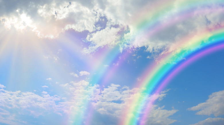 Rainbow in the sky with clouds