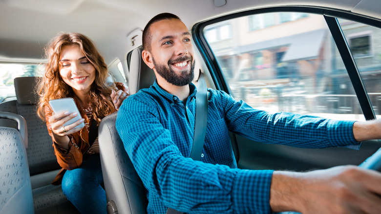 woman riding in a car with someone