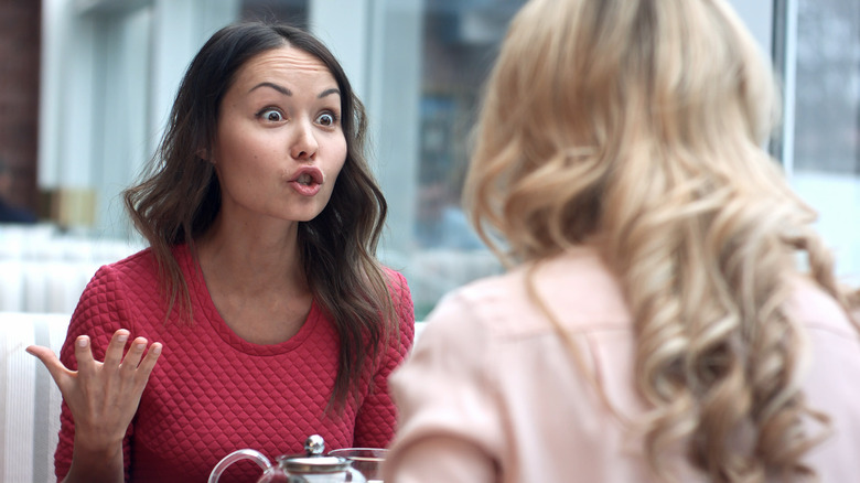 a woman sharing her anger with a friend