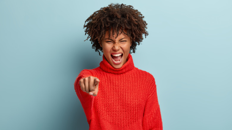 woman pointing her finger and yelling