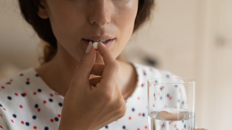 woman taking medication