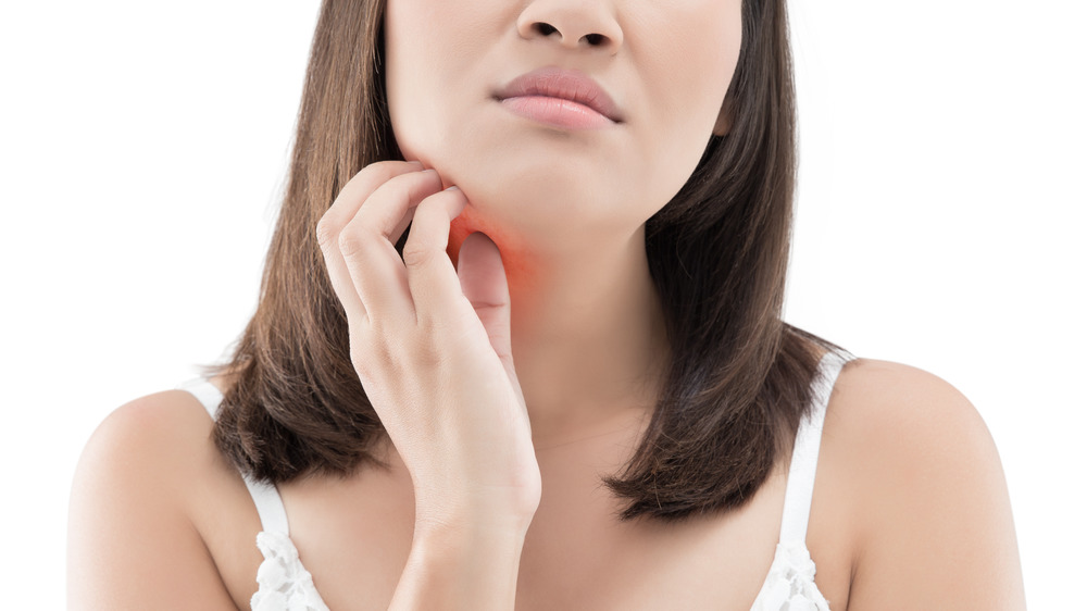 Woman scratching her chin