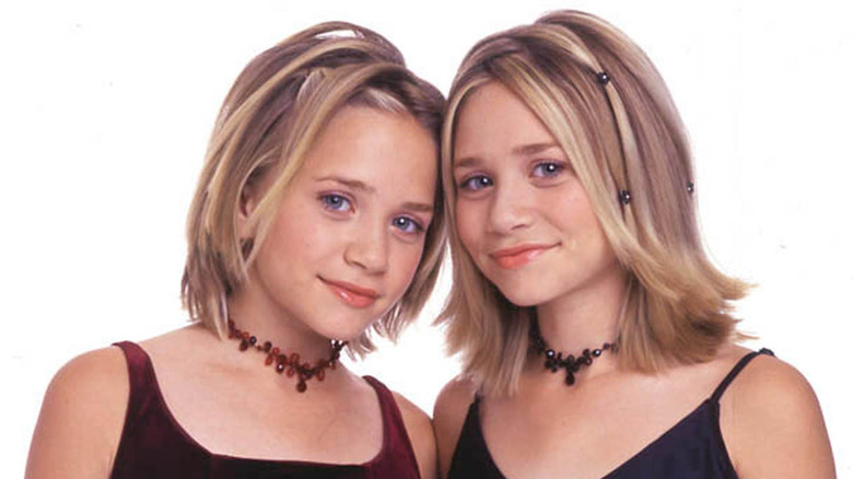Mary-Kate and Ashley Olsen posing as a pair in 2000