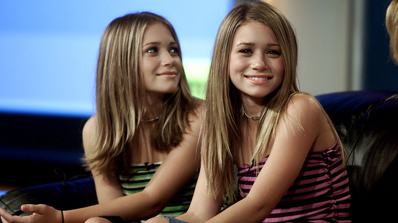 Mary-Kate and Ashley Olsen smiling together in 2001
