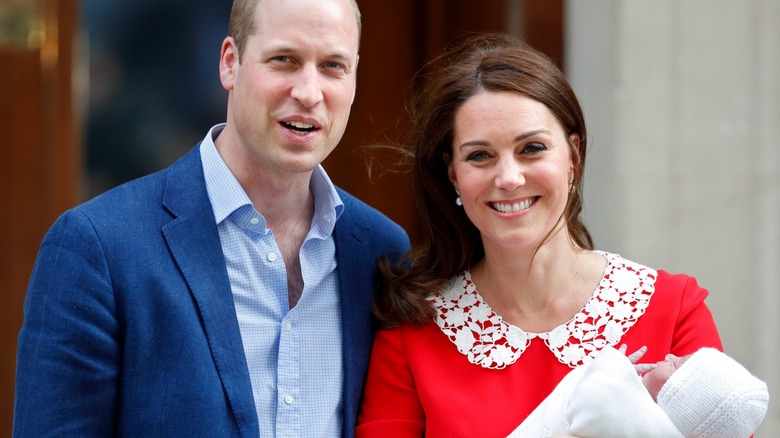 Prince William, Kate Middleton holding Prince Louis