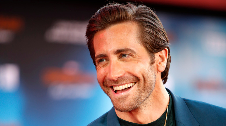 Jake Gyllenhaal laughing on red carpet 