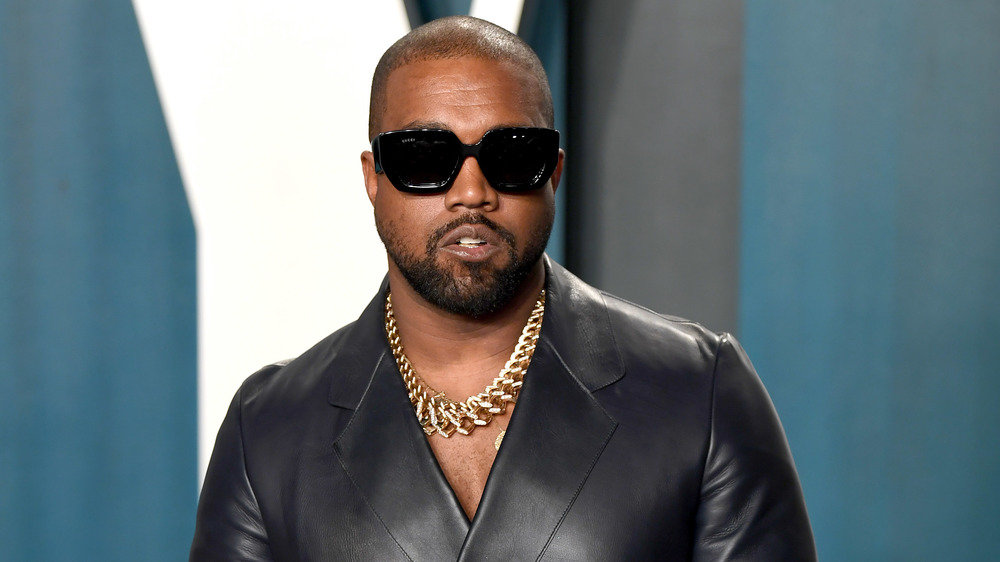 Kanye West posing in sunglasses