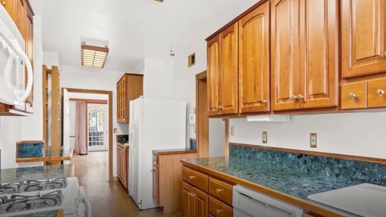 Narrow kitchen opening into living room