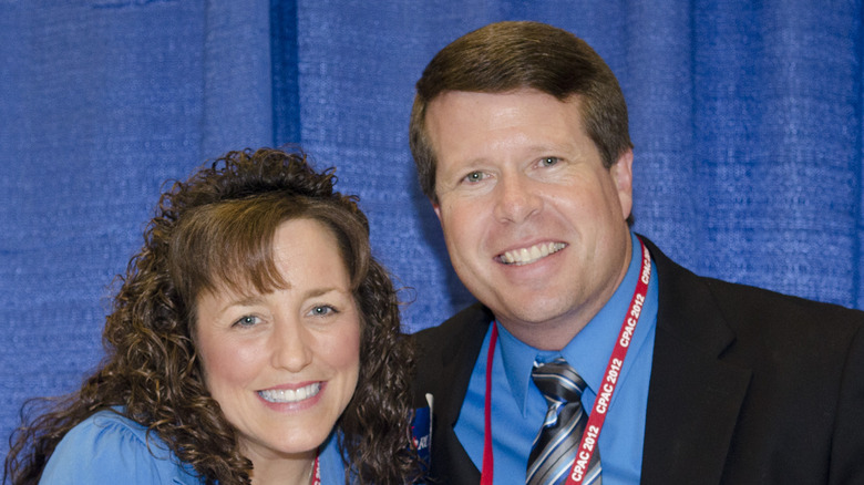 Michelle Duggar smiling with husband Jim Bob Duggar