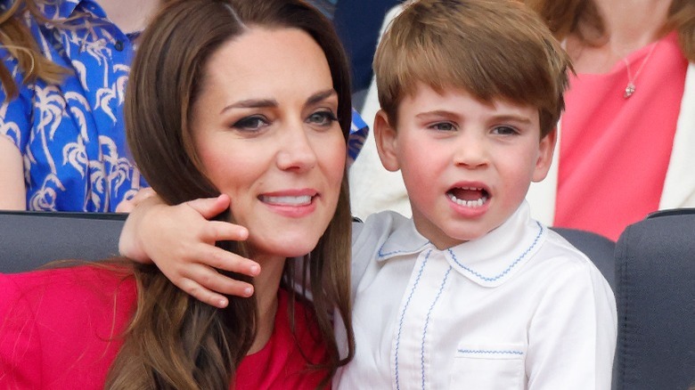 Prince Louis arm around Kate Middleton