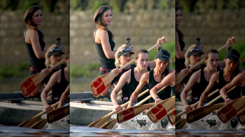 Kate Middleton standing in back rowboat