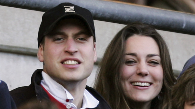 Prince William and Kate Middleton in bleachers smiling