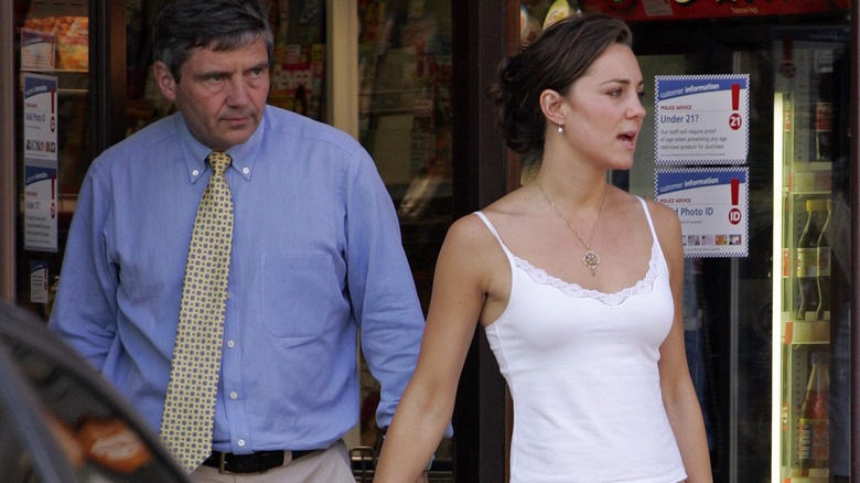 Kate Middleton and her dad leaving a store in 2000s