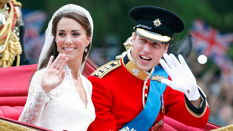 Kate Middleton and Prince William waving at their wedding