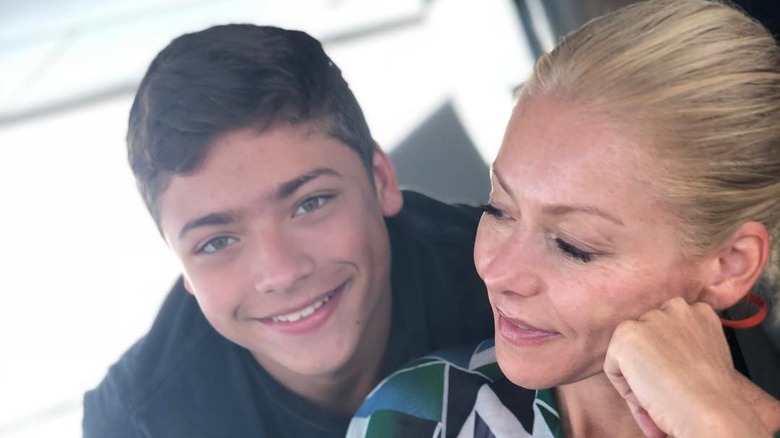 Kelly Ripa smiling with her youngest son Joaquin Consuelos