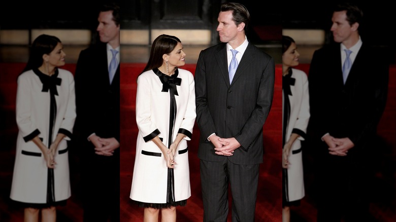 Gavin Newsom and Kimberly Guilfoyle smilng