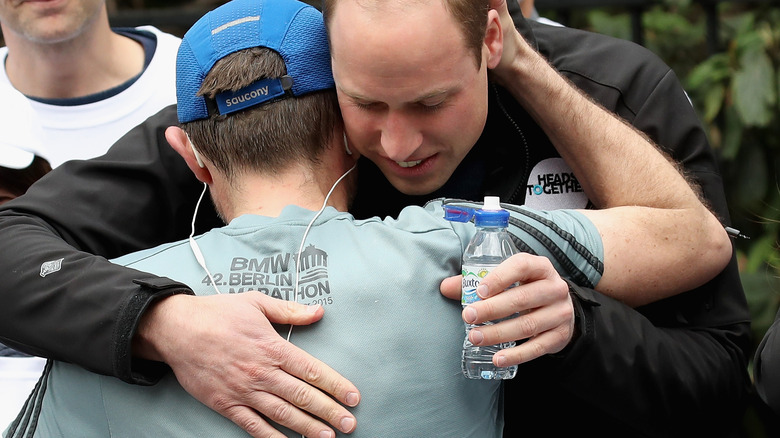 Prince William hug marathon runner