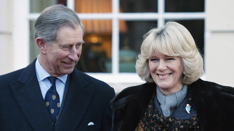 King Charles smiling at Camilla