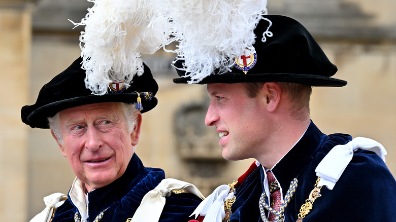 King Charles and Prince William at an event in ceremonial dress