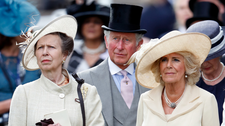 Princess Anne, King Charles, and Queen Camilla at an event