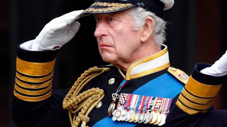 King Charles III saluting