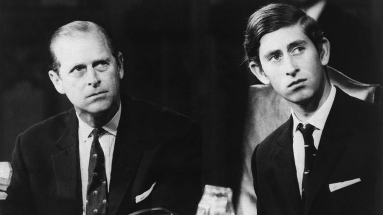 Prince Philip and King Charles III sitting down 