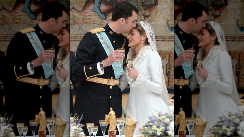 King Felipe kissing Queen Letizia's forehead