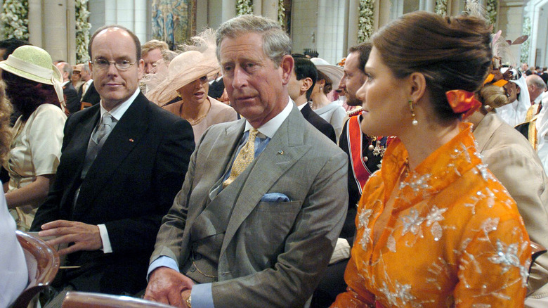 Prince Albert of Monaco, Prince Charles of England, and Crown Princess Victoria of Sweden sitting