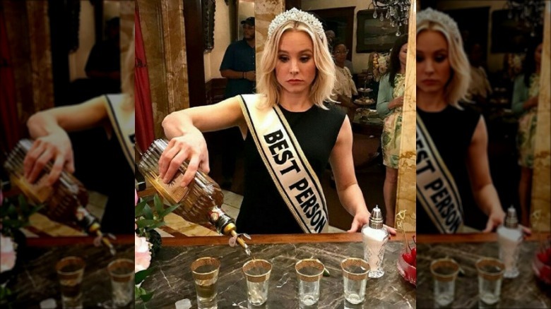 Kristen Bell pouring drinks on The Good Place