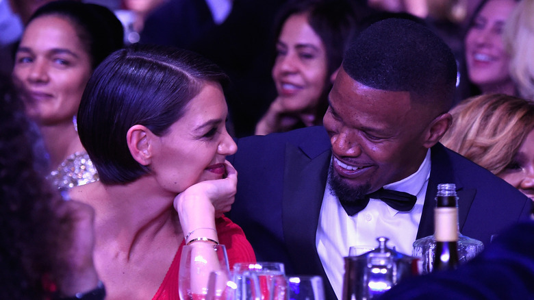 Katie Holmes and Jamie Foxx at an event. 