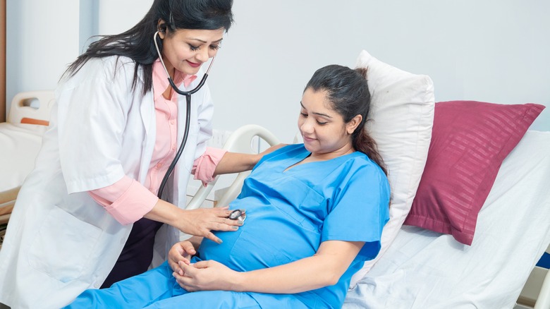 Pregnant woman being examined