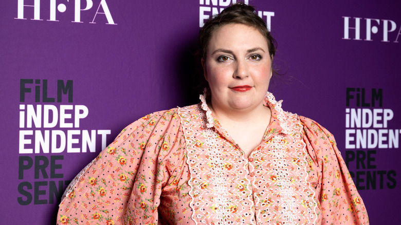 Lena Dunham posing for camera at event