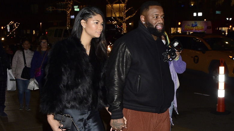 Chanel Iman and Davon Godchaux walking