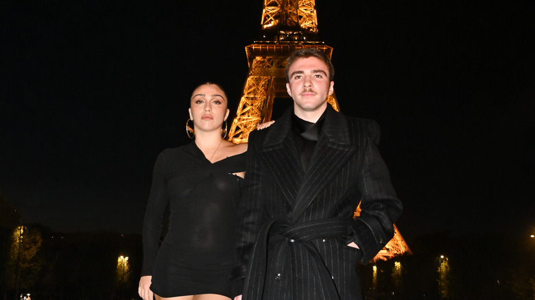 Rocco Ritchie and Lourdes Leon in front of Eiffel Tower