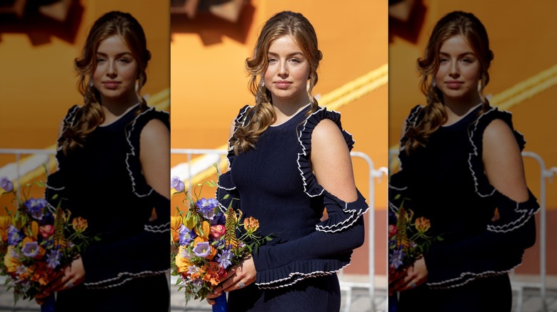 Princess Alexia posing with flowers