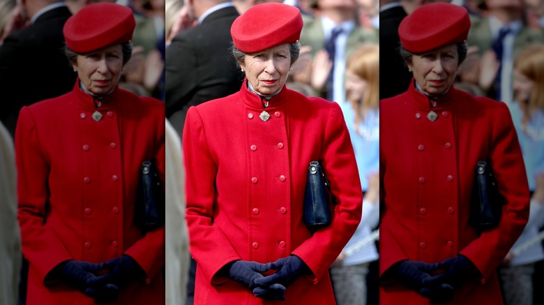 Princess Anne walking in red outfit