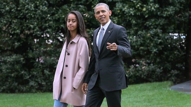 Malia Obama walking with Barack Obama