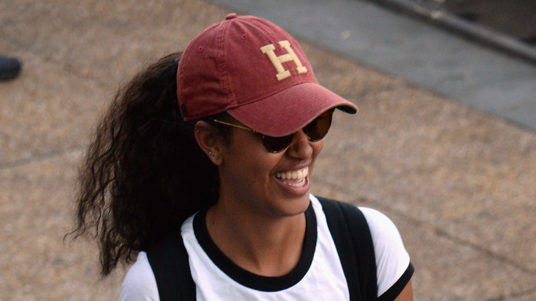 Malia Obama laughing in Harvard cap