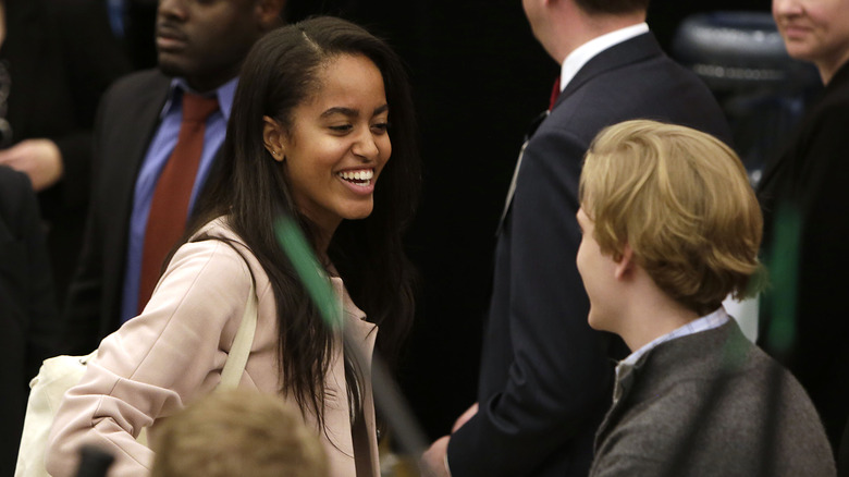 Malia Obama laughing in crowd