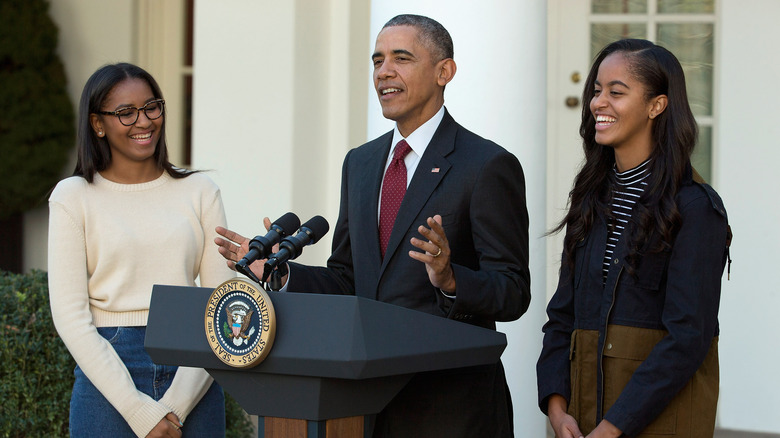 Sasha and Malia Obama with Barack Obama