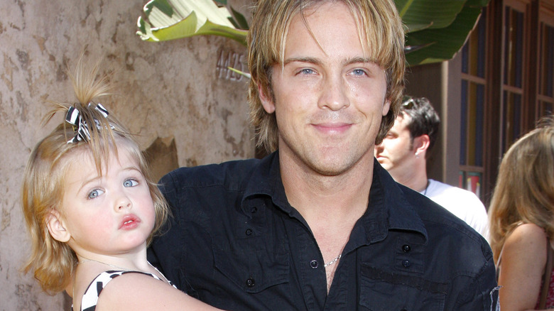 Larry Birkhead carrying Dannielynn