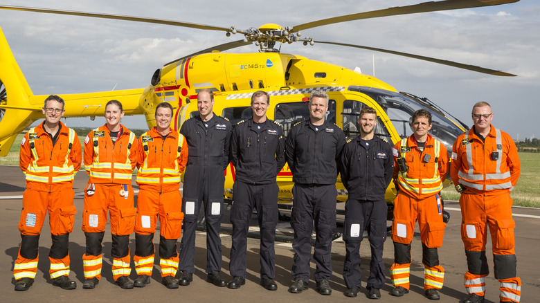 Prince William smiling with fellow pilots