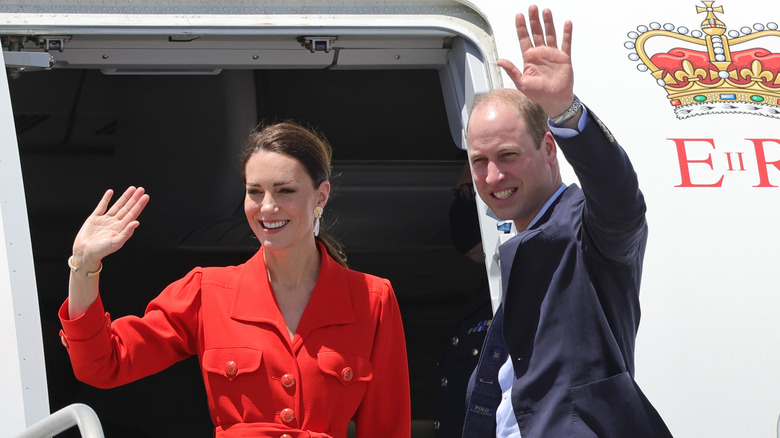 Prince William and Princess Catherine smiling  and waving