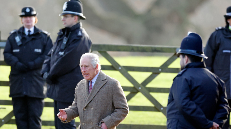 Security guards surrounding King Charles III