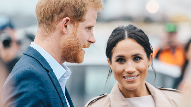 Prince Harry and Meghan Markle talking to each other