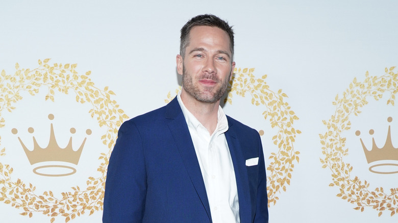 Luke Macfarlane poses on the red carpet