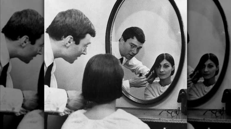 Vidal Sassoon cutting a woman's hair