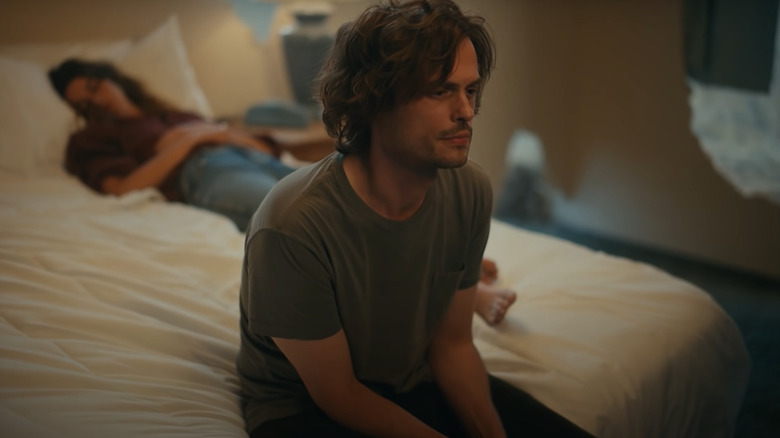 Matthew Gray Gubler sitting at the end of the bed