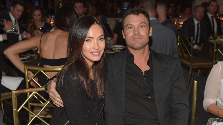 Megan Fox and Brian Austin Green sitting