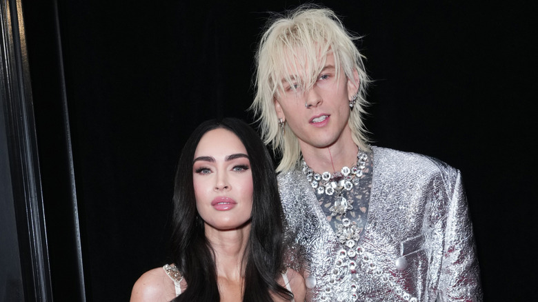 Machine Gun Kelly smiling alongside Megan Fox.